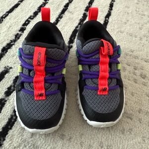 New Balance Gray Sneakers with Red and Purple Highlights